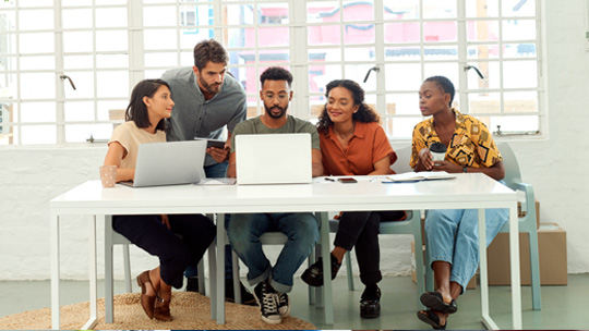 Group of colleagues working together at a table.